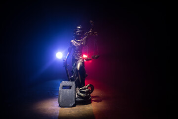 Law concept. Miniature colorful artwork decoration with fog and backlight. The Statue of Justice -...