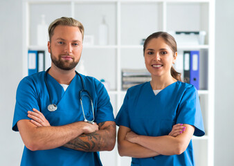 Professional medical doctors working in hospital office, Portrait of young and confident physicians.