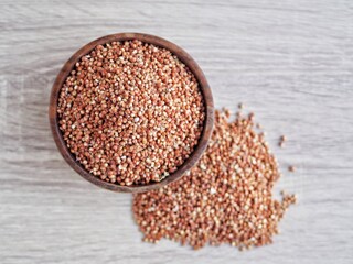 Sorghum millet grain pile on white background