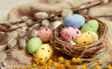 Christian holiday. A painted quail egg lies in the nest.