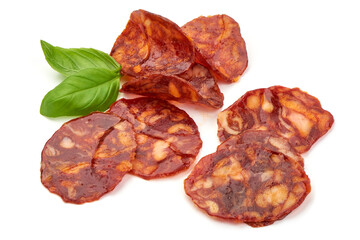 Spanish pork chorizo sausage slices, close-up, isolated on white background