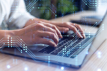 Woman typing the keyboard to create innovative software to change the world and provide a...