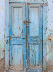 Old wooden doorway in abandoned egyptian house