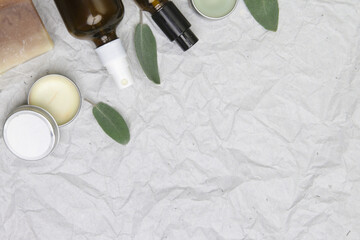 Natural, organic, plastic free skin care products. Facial serums, essentials oils, creams and soap bars, top view with copy space.