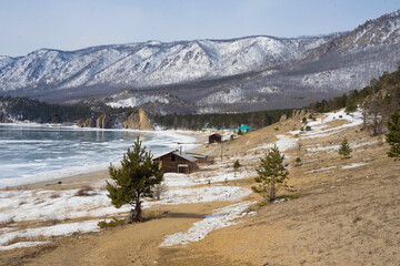 Obraz premium view of the frozen lake, mountains and trees