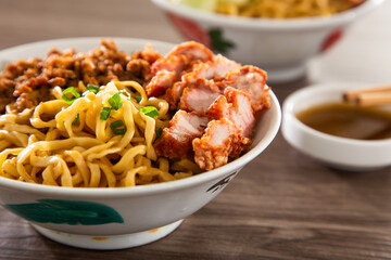 Kolo Mee is a Sarawak Malaysian dish of dry noodles tossed in a savoury pork and shallot mixture, topped off with fragrant fried onions.