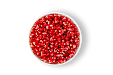 Pomegranate. Ripe berries in a white plate. Isolated on white