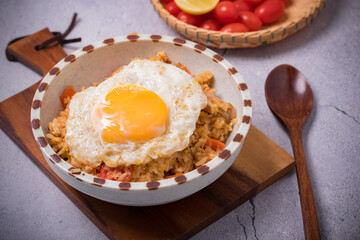 Fried rice, fried eggs and vegetables in ceramic cups