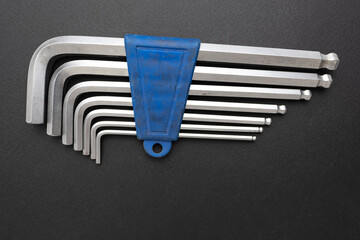 Set of hex keys on a black background.