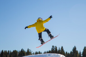 A snowboarder on a snowboard. Extreme winter sports.Rest in winter.