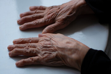 Hand of an old woman. 90 years old. selective focus.