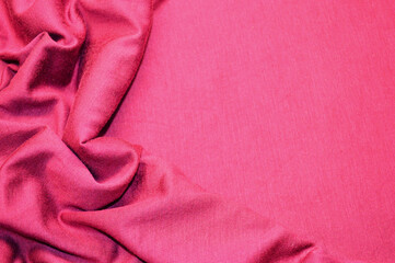 Pink textile pattern as a background. Pink material texture on fabric