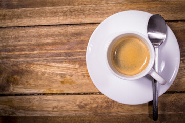 A Cup of Espresso or coffee on a wooden table - studio photography