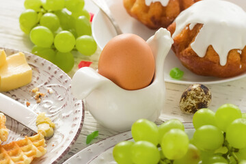 Easter. An egg in a stand on a festive table.