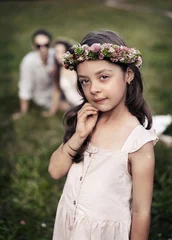 Foto op Canvas Portrait of a liitle, cute girl posing in the summer garden © konradbak