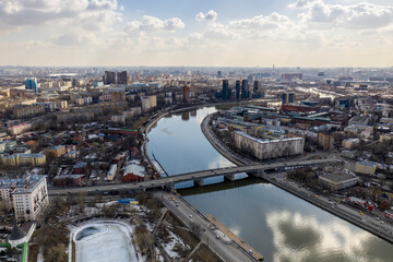 Obraz premium panoramic view from drone on cityscape with river and bridges 