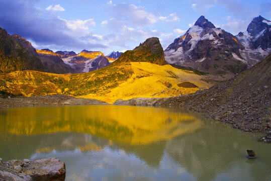 Sunset on Lake Bashkara against the background of the Caucasian Wall in the Elbrus region