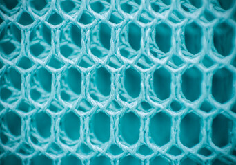 Blue mesh background. Mesh texture. Macro photo