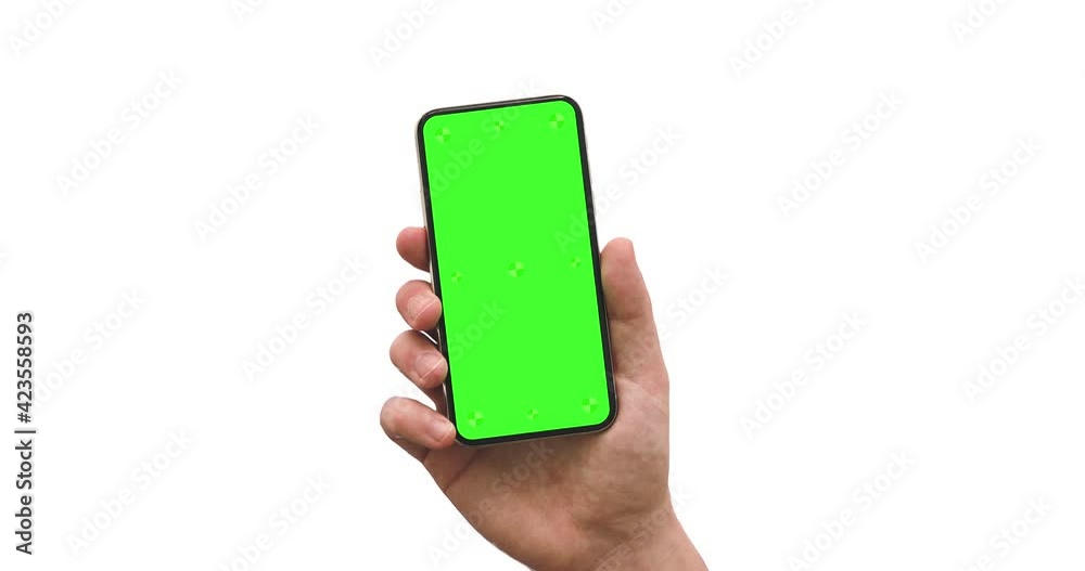 Wall mural smartphone blank green screen in man hand, slide from bottom - alpha matte included. vertical and an