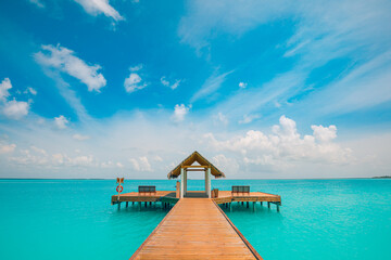 Positive beach vibes mood, motivational, loneliness scenery. Water villa over relax calm sea lagoon. Blue cloudy sky, peaceful water. Inspirational summer scenery, success, moving forward concept