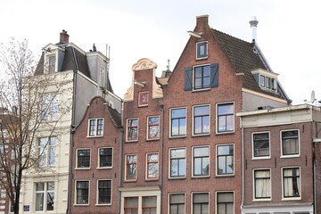 Fototapeta na wymiar Amsterdam Traditional Brick House Facades in the Red Light District
