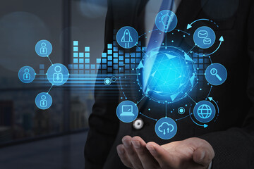 Businessman hand holding a digital hud, data symbols and network circuit