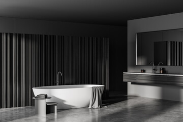 Fototapeta na wymiar Grey bathroom interior with bathtub and sink with concrete floor
