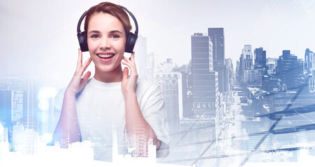 Smiling young woman wearing headphones, skyscrapers toned