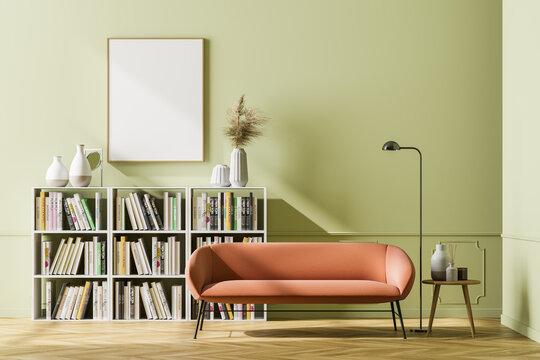 Bright waiting room interior with bookcase, couch and poster