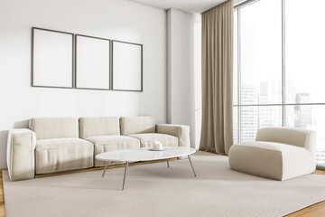 White sofa in living room interior with windows and three posters