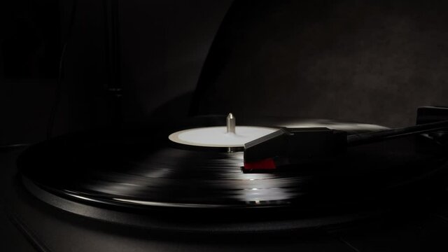 Record player in close-up - playing a vinyl - studio photography