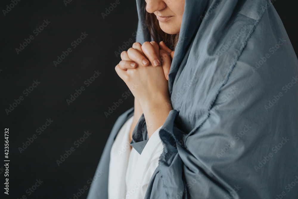 Wall mural Mother Mary on a black background