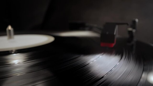 Amazing view over a record player playing a vinyl - studio photography