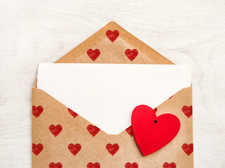 Envelope with heart-shaped drawings. Beautiful greeting card. Close-up, view from above. Holiday concept. Congratulations for family, relatives, friends and colleagues