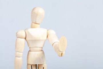 Wooden figurine, man doing a 