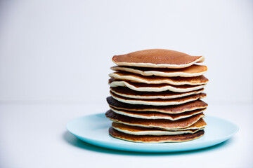 Stack of Tasty pancakes on white background