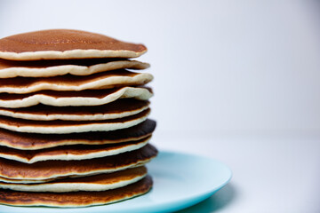 Stack of Tasty pancakes on white background