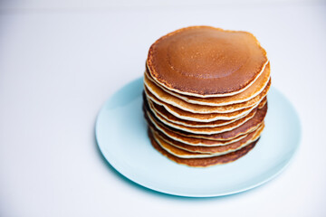 Stack of Tasty pancakes on white background