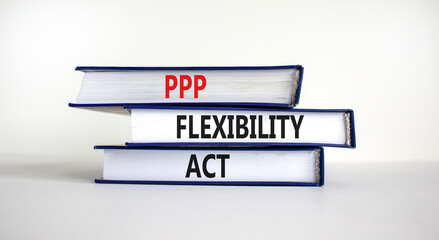 PPP, paycheck protection program flexibility act symbol. Concept words PPP flexibility act on books on a beautiful white background. Business, PPP paycheck protection program flexibility act concept.