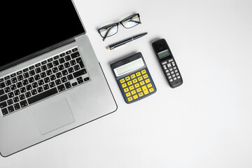 modern and outdated gadgets for daily use on a white floor, top view