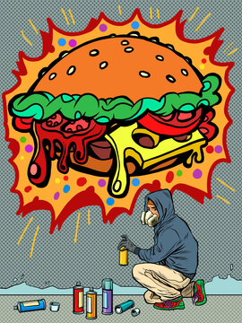 a teenage boy draws a graffiti image of a burger. fast food