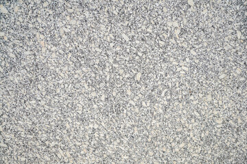 Stone structure of a stone slab, cut and processed from natural stone, photographed in daylight
