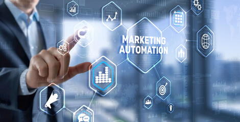 Marketing automation on the virtual screen. Man clicks on the inscription Marketing