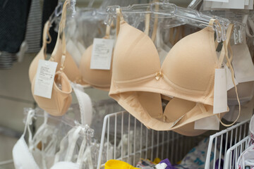 Bras on display in a store. Trade in underwear in a retail network. Close-up