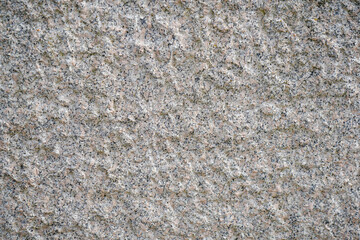 Stone structure of a stone slab, cut and processed from natural stone, photographed in daylight
