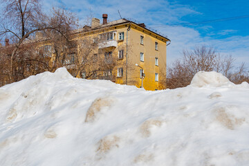 City streets are covered with snow. Snowdrifts reach human height 