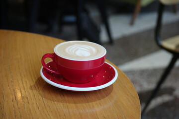 Red cup coffee. Cappuccino, Cappucino in Coffee House served on table