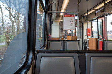 Interior view inside empty passenger trains or light rail tram of German railway train system in Düsseldorf, Germany. 