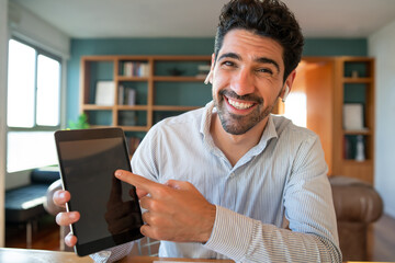 Businessman on a work video call from home.