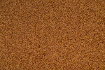 Dry brown instant coffee texture or background.